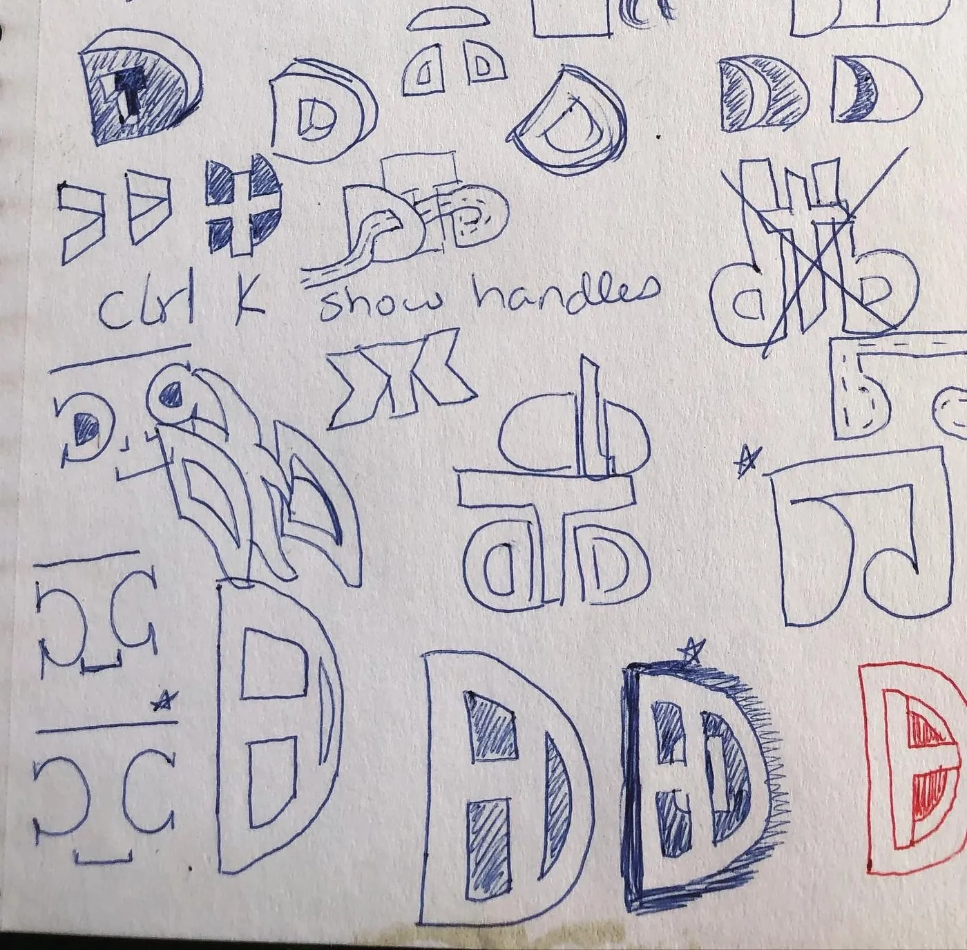 Notebook page of letter D sketches