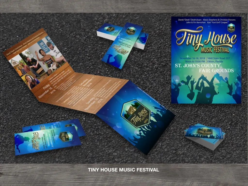 Brochure, poster and tickets laid out together